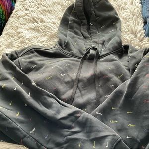 Nike black hoddie with assorted color Nike symbol. Size XL